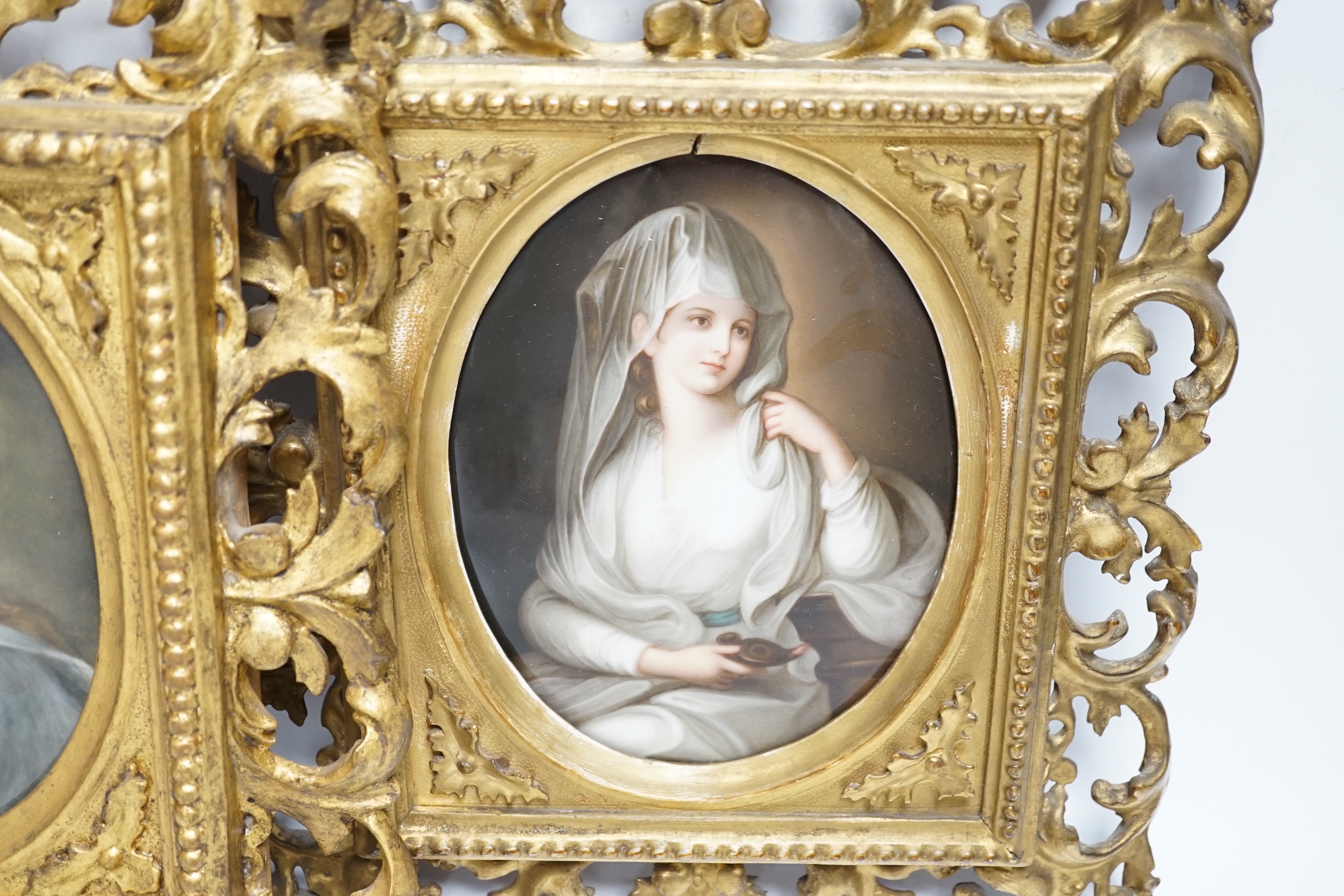 Two 19th century Continental porcelain oval plaques, in similar gilt Florentine frames